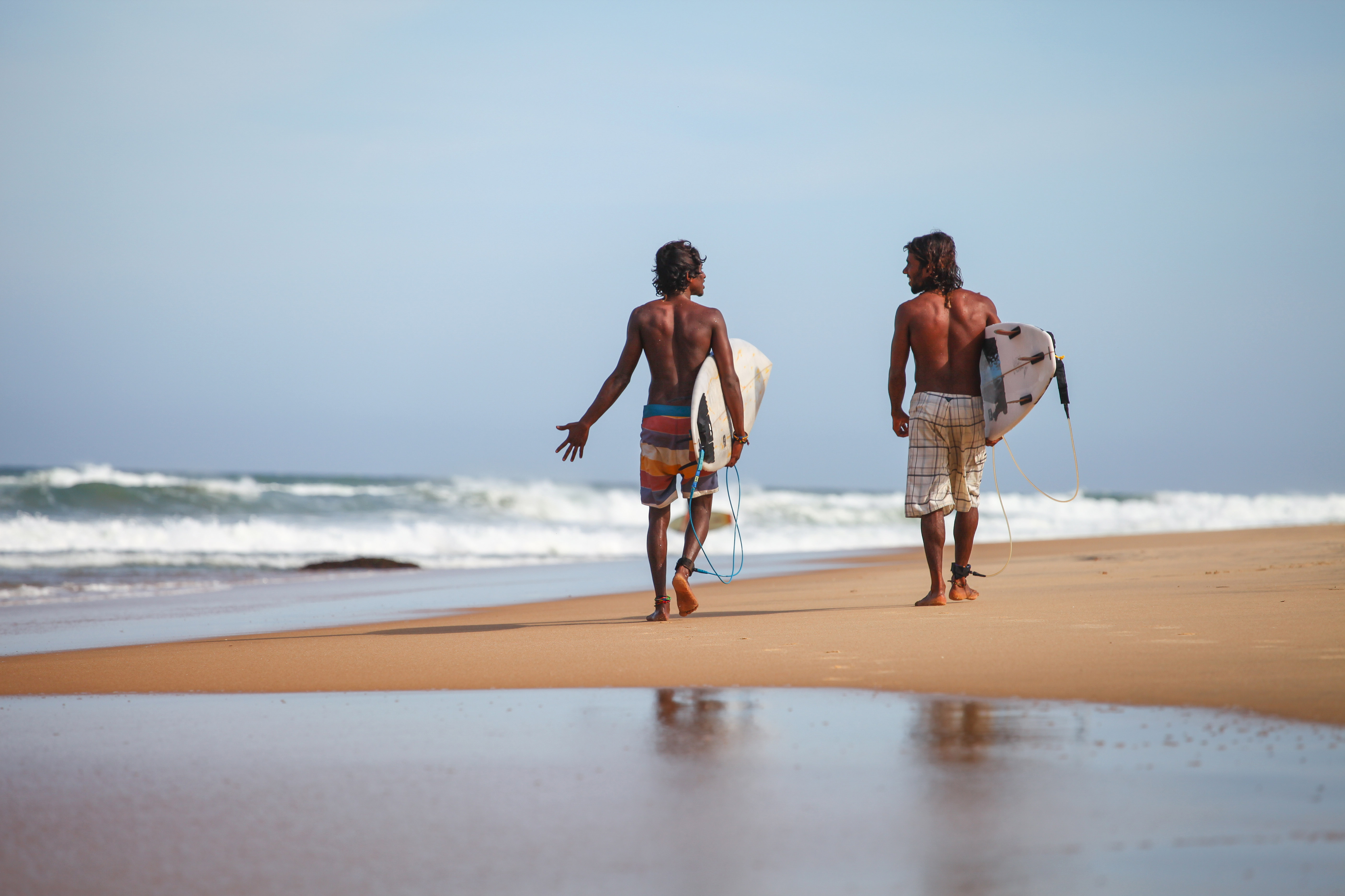 Two local surfers in Arugam Bay on the search for the perfect swell. Photo: Charlie Malmqvist.