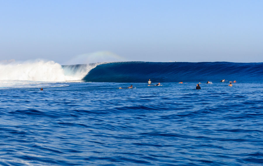 The view from the water as a set hits the end of the reef and starts to approach the lineup. Photo: David Nilsen