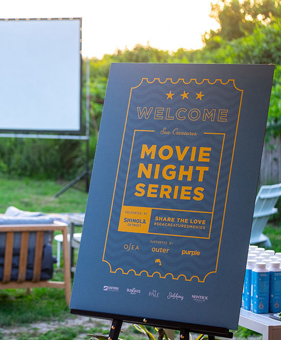 Movie nights at the Boneyard sign during the Sea Creatures inspired movie night series with Whalebone