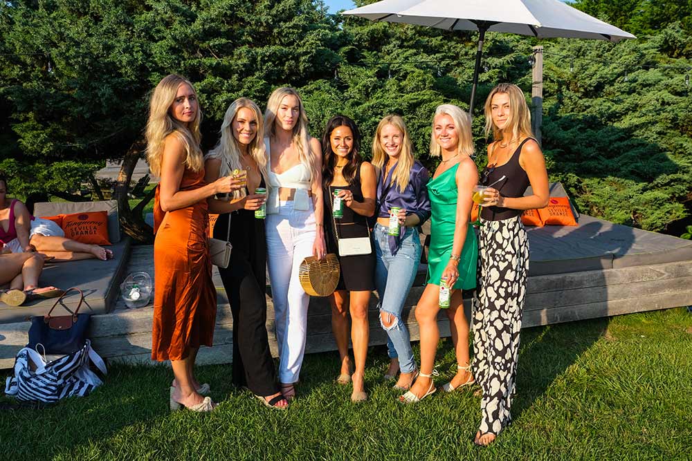 A group of women stand in the sun at the Tanqueray event at Sole East in Montauk 