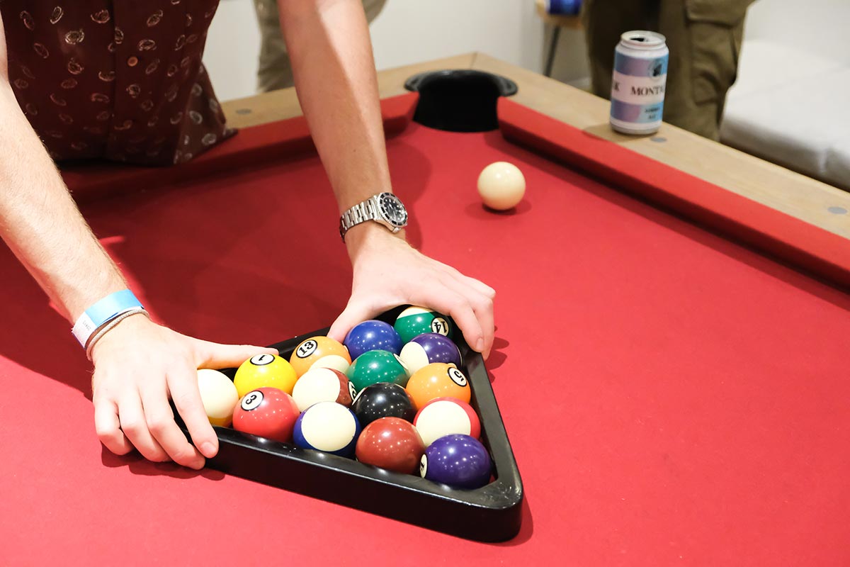 Hands racking pool balls at the Whalebone Magazine Wine Issue Release Party at Whalebone on Bleecker in New York City