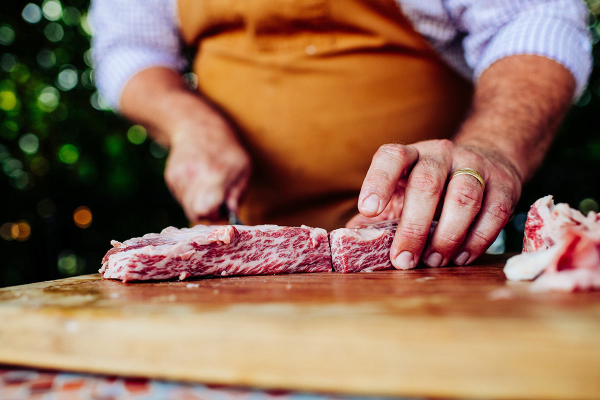 Chef Jean-Paul Bourgeois of Louisiana cuts into Snake River Farm beef with lots of marbling
