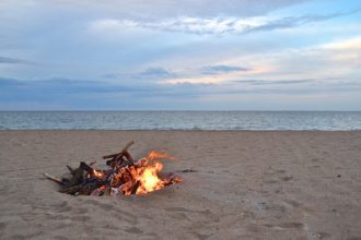 small bonfire on beach