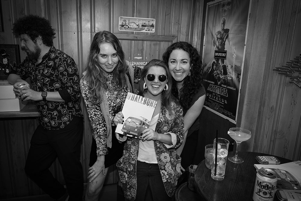 Guests holding the Hippie Issue of Whalebone Magazine at the Hippie Issue Release Party by Rite Dye at the Flower Shop in New York City.