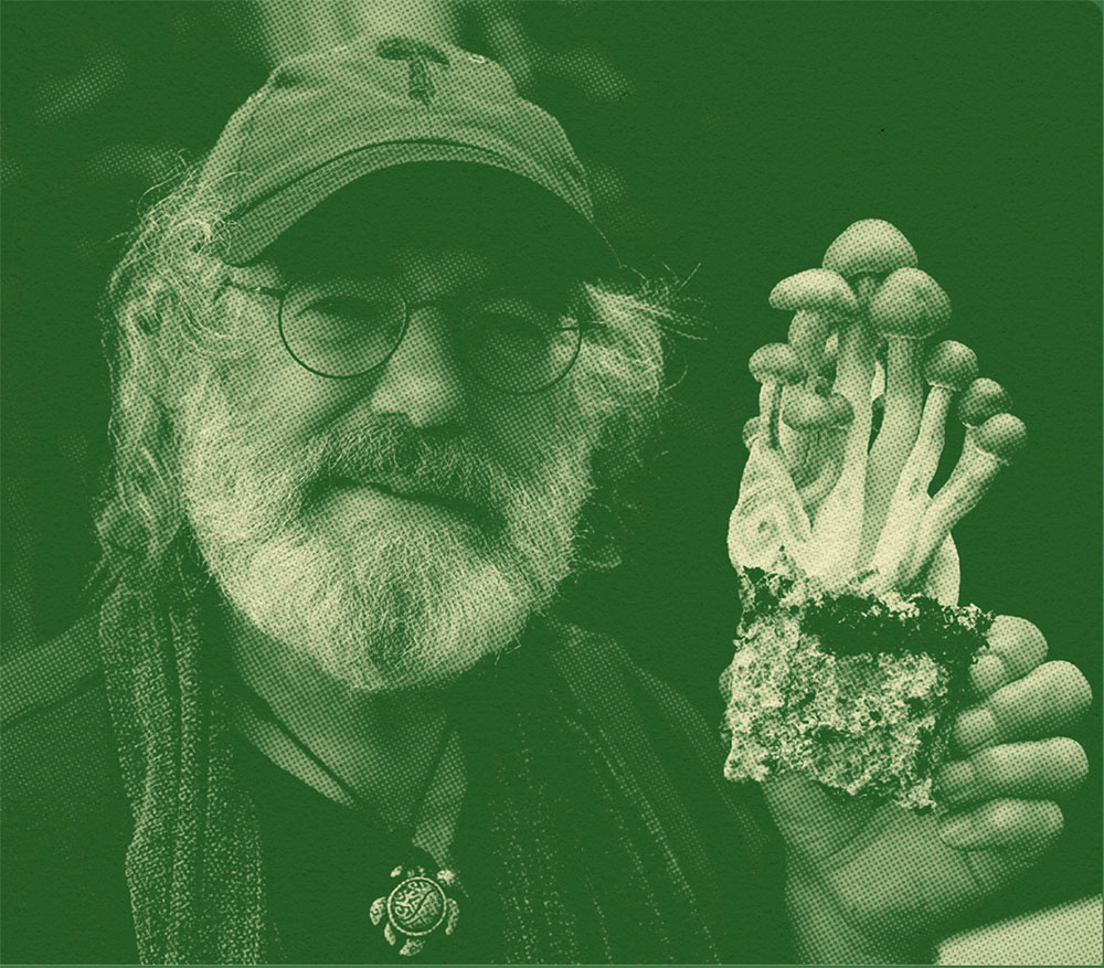 Mycologist Paul Stamets holding up a mushroom species
