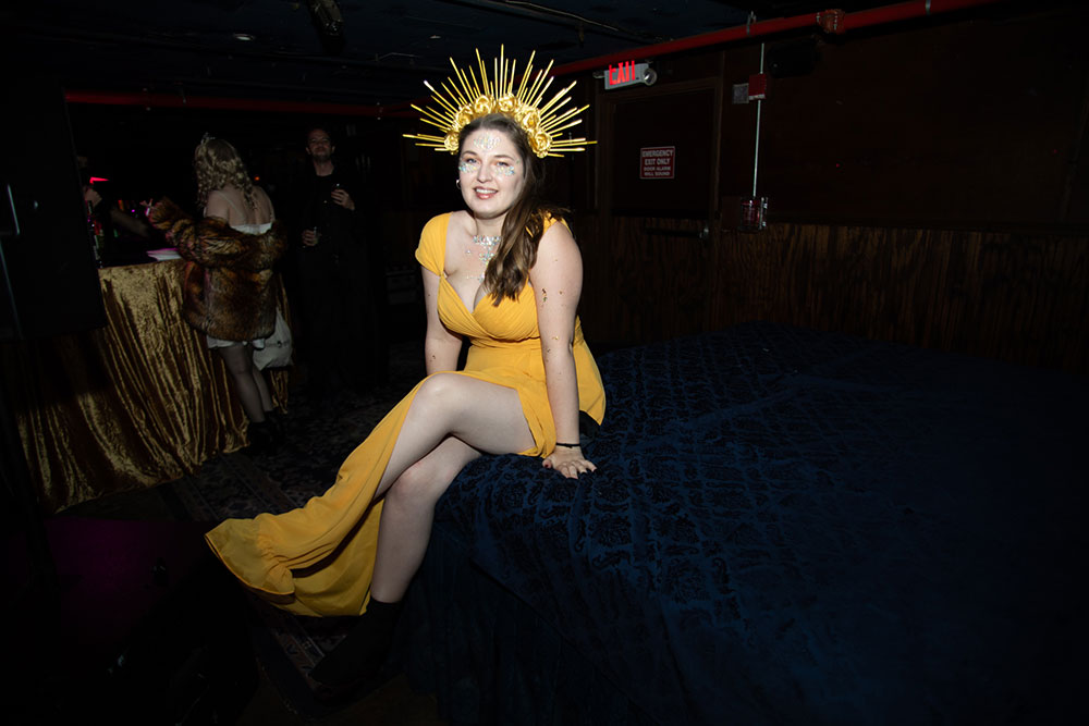 McKittrick Hotel Halloween Party 2021, woman in goddess costume with gold crown and yellow dress