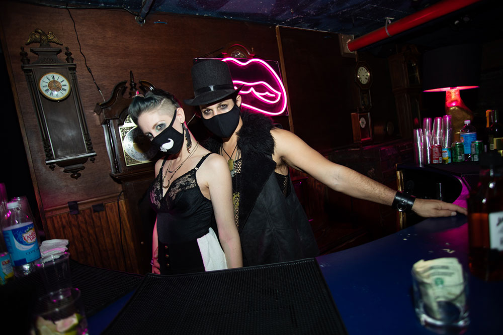 McKittrick Hotel Halloween Party 2021, bartenders wear masks and are dressed in blackcostume