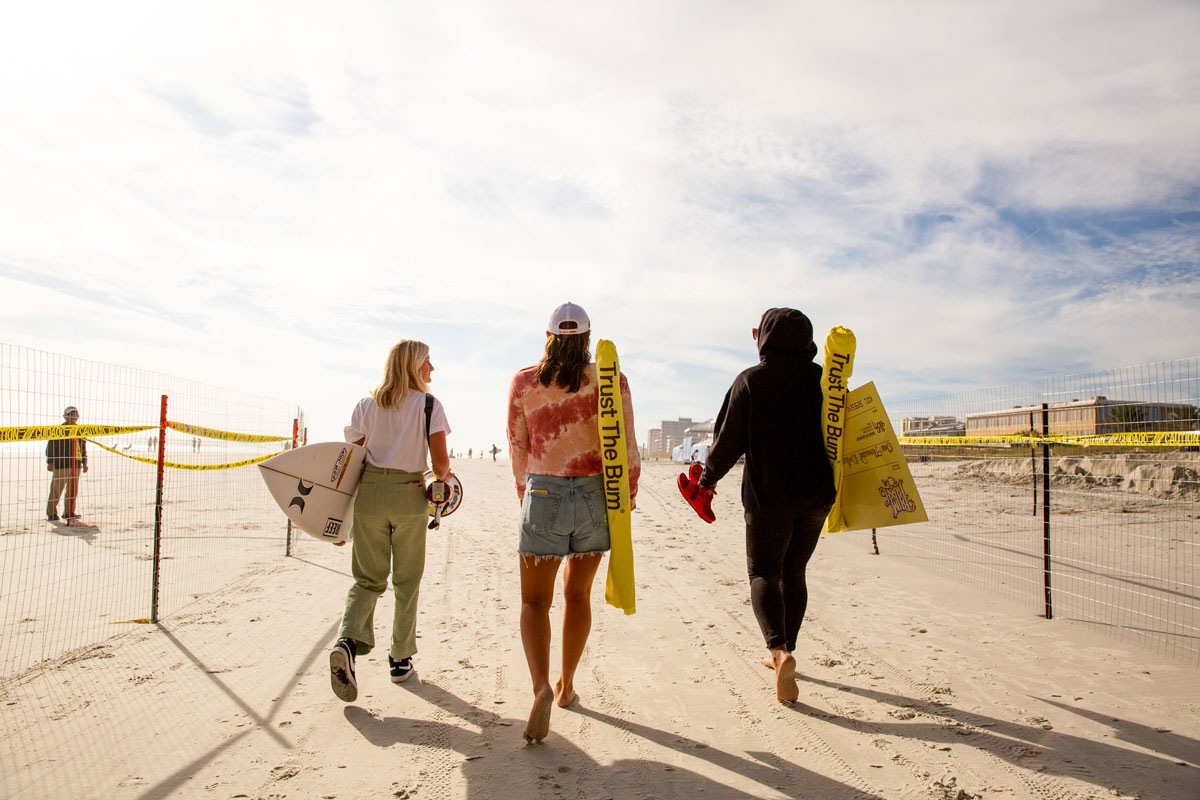 Kylie Pulcini, Carissa Moore, Gigi Lucas, walking on Jacksonville Beach