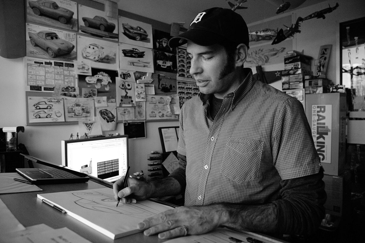 Jay Shuster sketching at desk