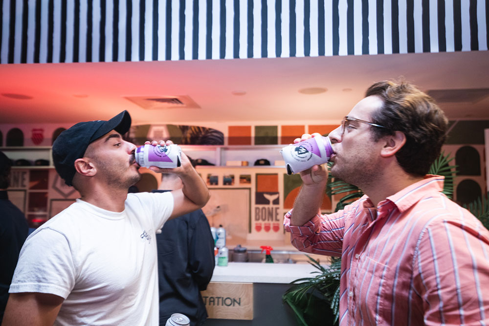 guests drinking Montauk Brew co at the k-Swiss x whalebone classic 66 event during Art Basel at SHOWFIELDS Miami