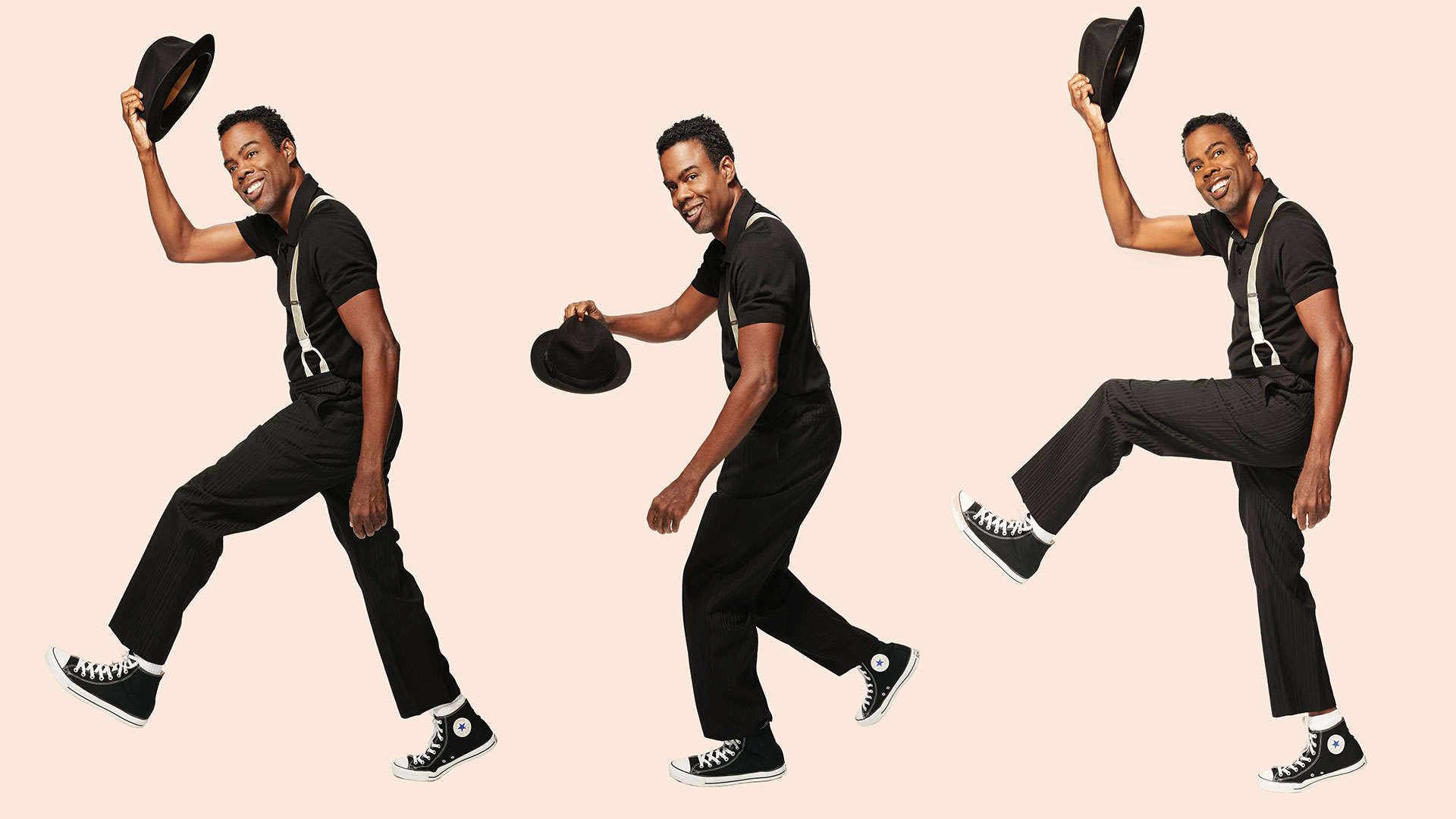 Chris Rock x3 on cream background, tipping his hat to yo. He's wearing converse, black pants, black shirt, and white suspenders.