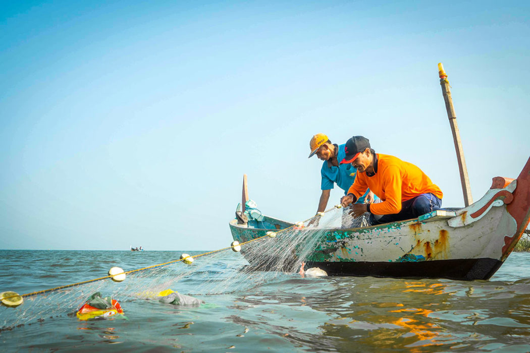 Local fishermen cleaning up trash in ocean for GOT BAG