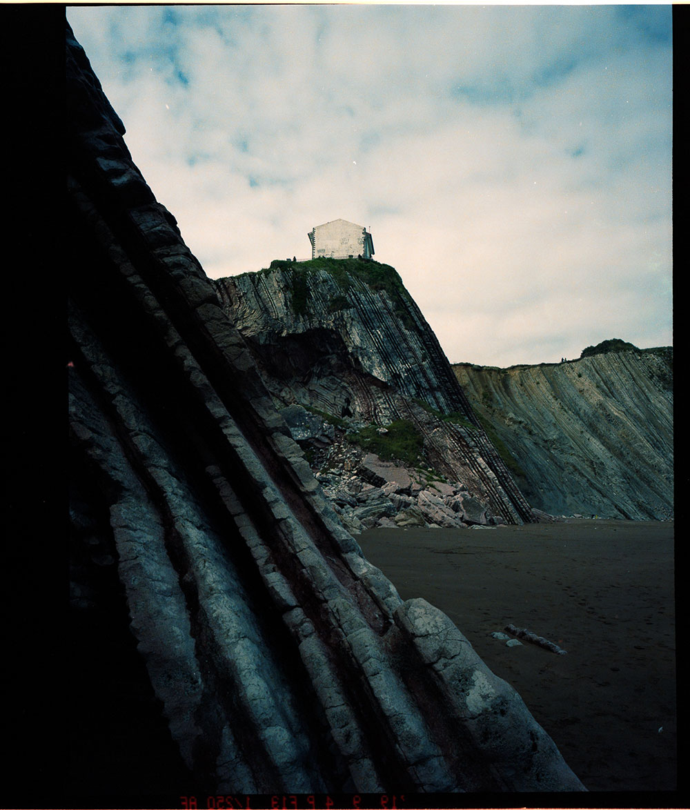 Photo taken by Gunner Hughes of cliffs in Europe with house on top