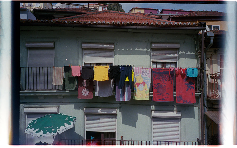 Photo taken by Gunner Hughes of laundry hanging over balcony in Europe