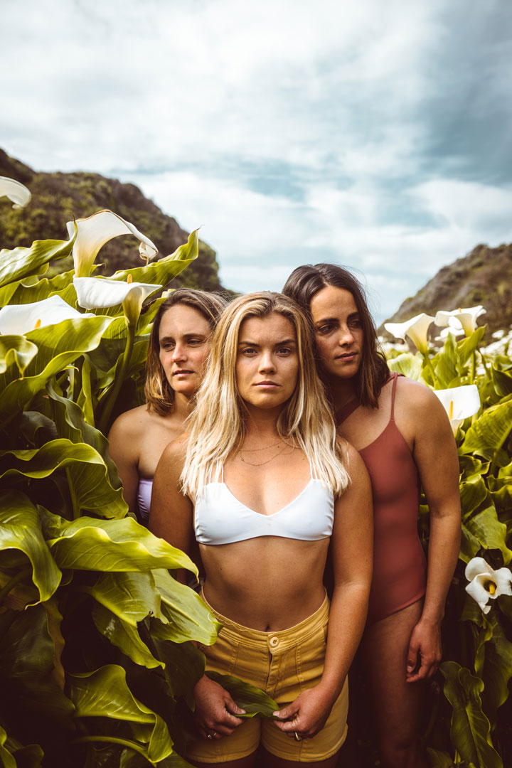Photograph of three women standing in a field of white lilies  by rob schanz