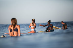 Nature of Surf women, image of three women on surfboards