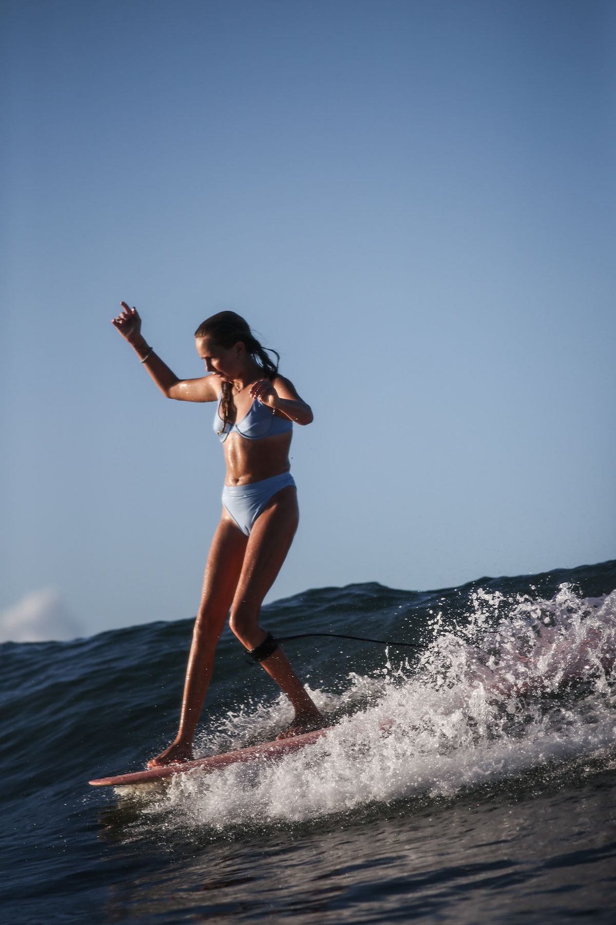 Nature of Surf Women, women surfing on edge of board