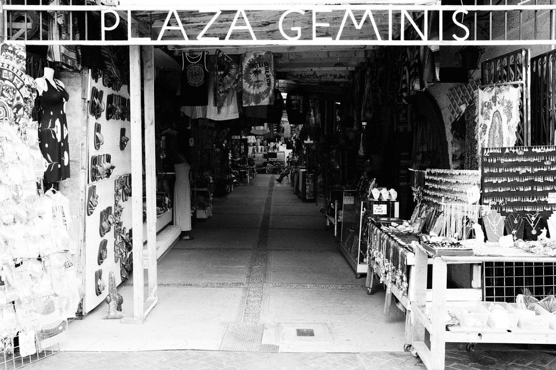The entrance to plaza geminis, a street market with booths of goods like jewelry, clothes and more