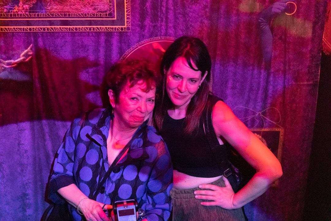 Photo of Meryl Meisler and Laura June Kirsch posing for a picture together on their way out of the club.