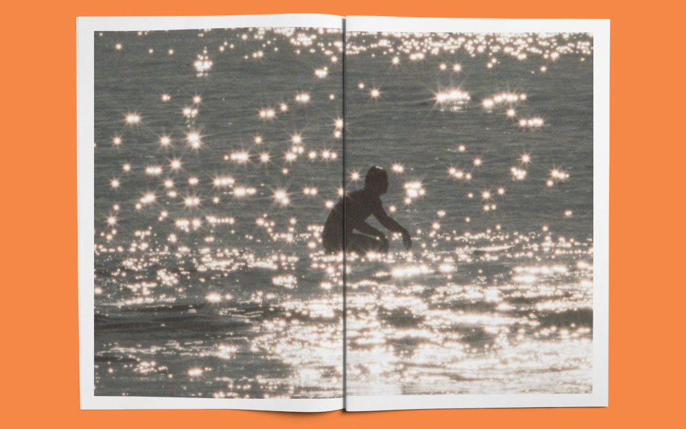 the venice issue inside spread of surfer on glittering water