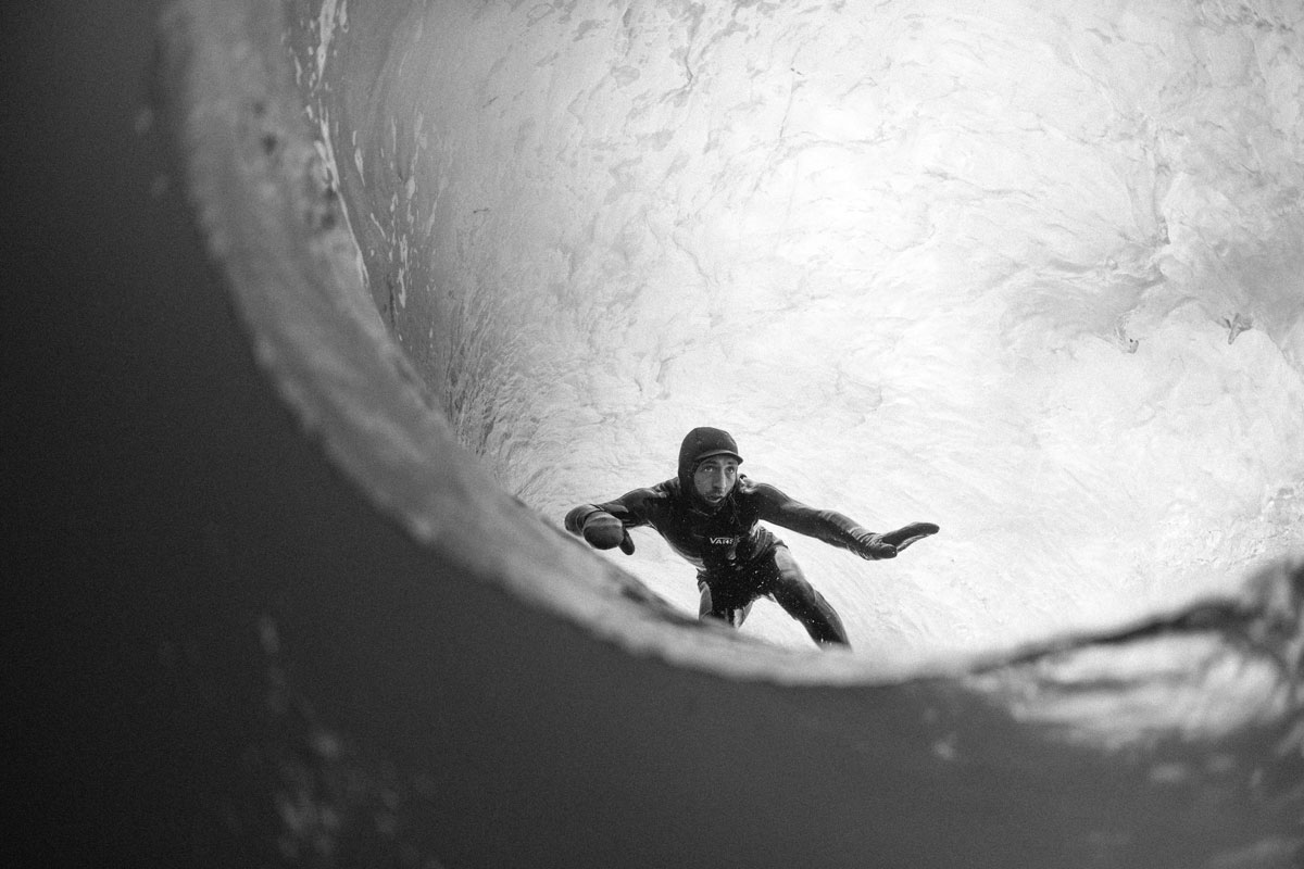 black and white underwater shot of surfer