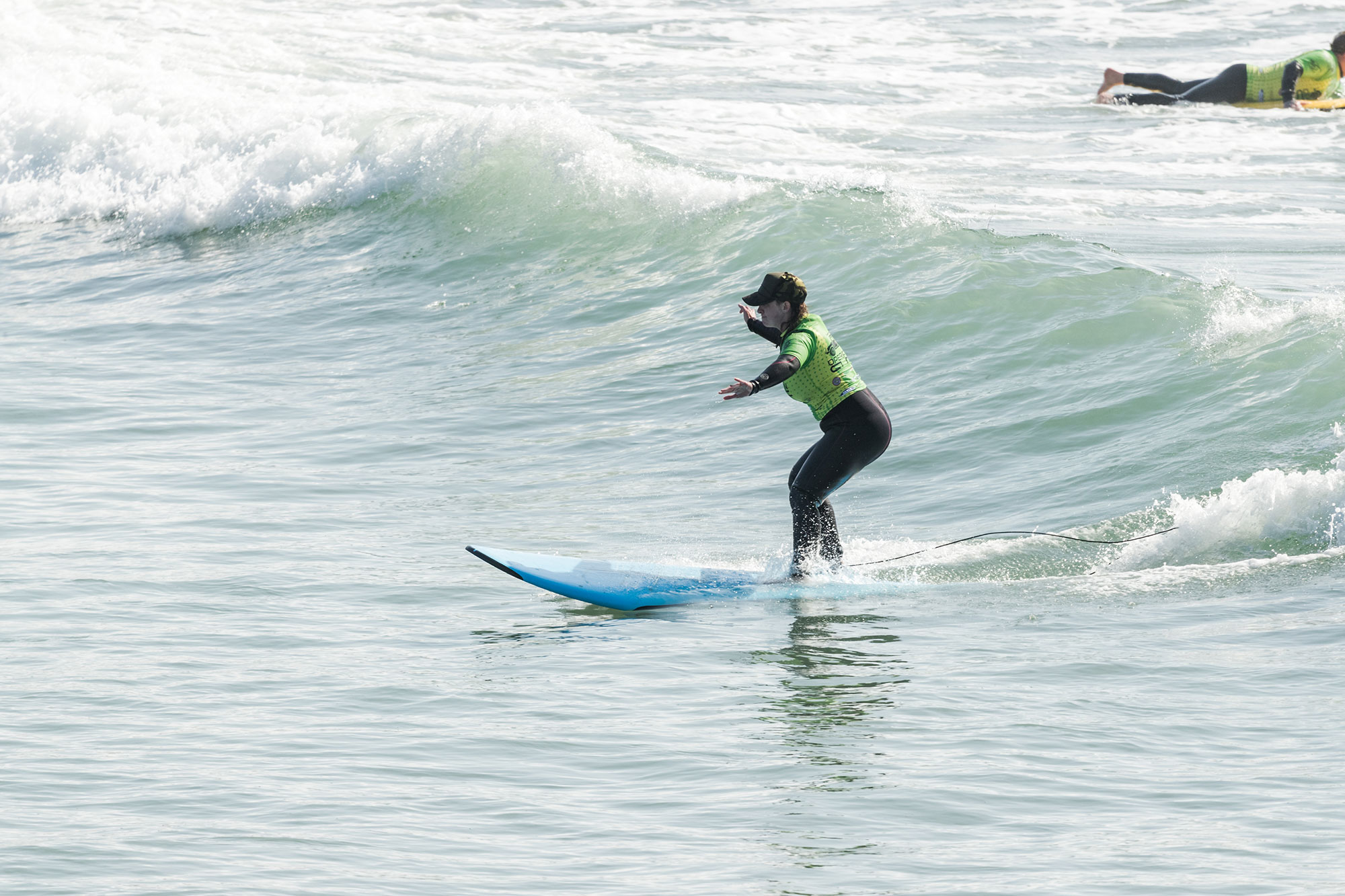 stephanie, veteran, riding a wave with operation surf