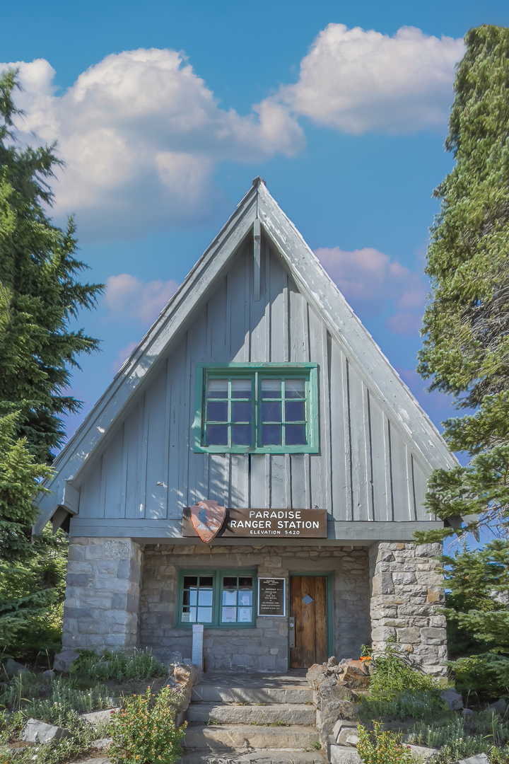 Photo of a gray and green a-frame ranger station in Mount Rainier National Park