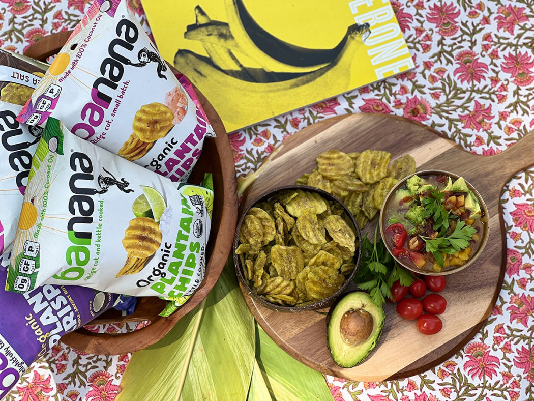barnana plantain chips on table spread with salsa and avocado