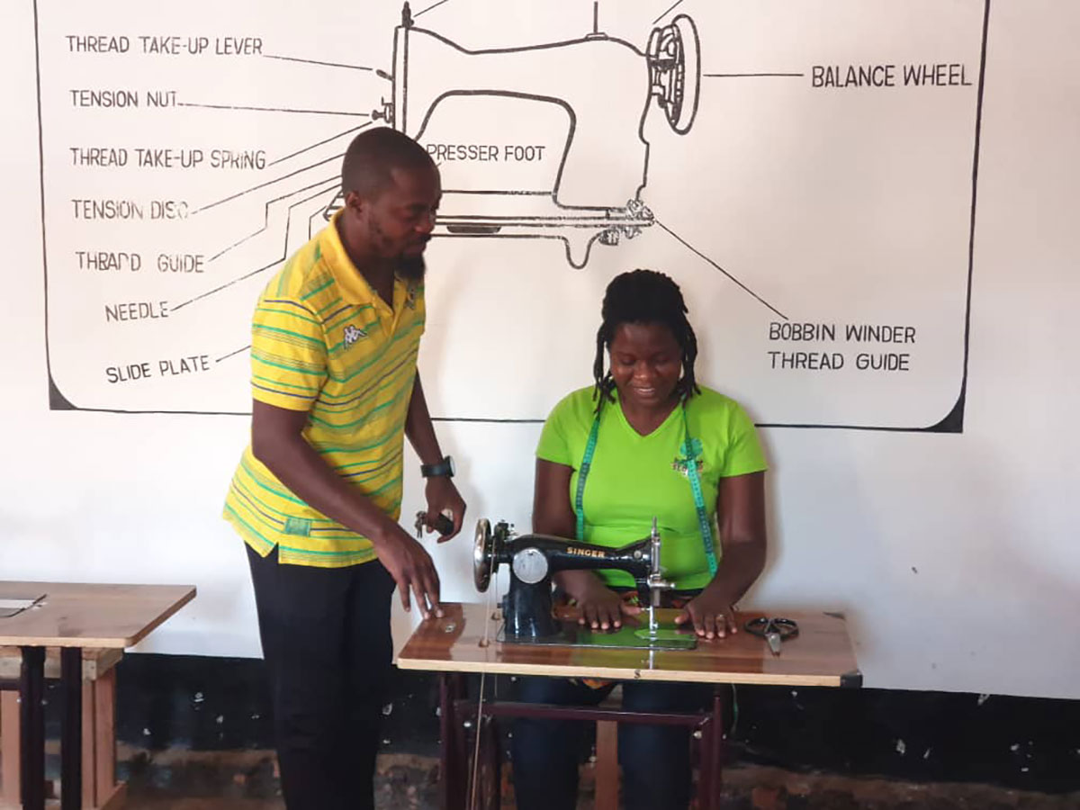 Malawi refugees sewing WISSP pads