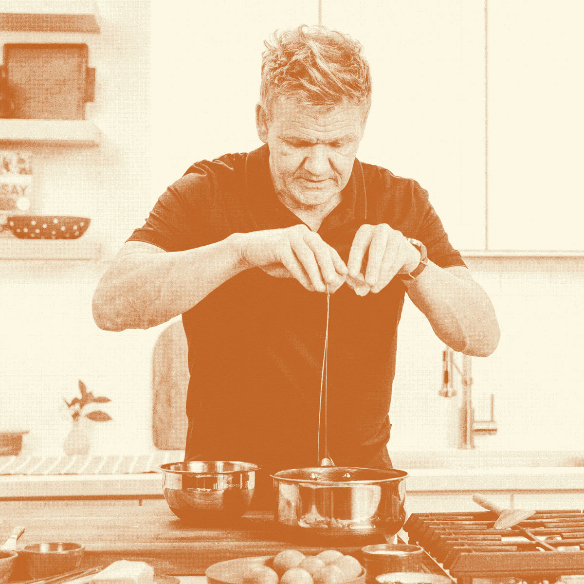 Chef Gordon Ramsay cracking an egg into a bowl. 