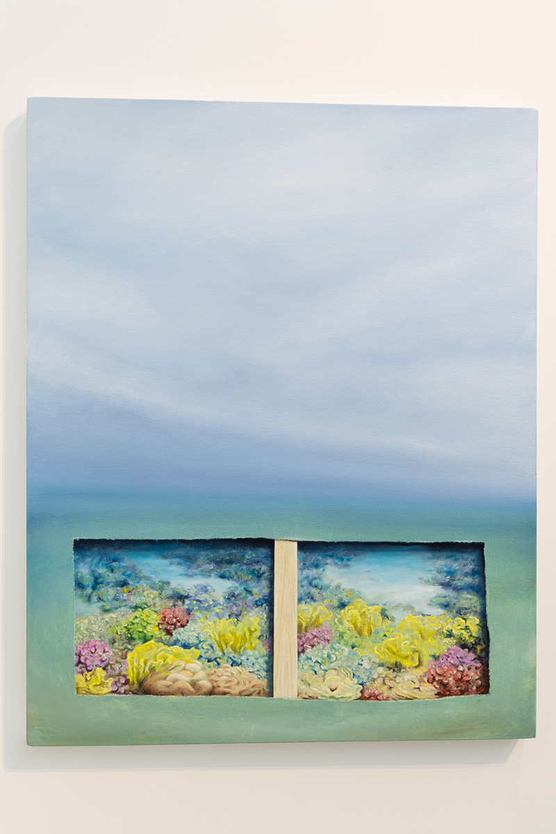 A photo of Jeremy Shockley's oil on canvas painting entitled "Under The Sea." The painting depicts a hazy blue sky that blend into a hazy green ocean. At the bottom of the painting, it appears as if a rectangle was cut out of the canvas to reveal the ocean floor covered in bright yellow, pink and green corals and plants.