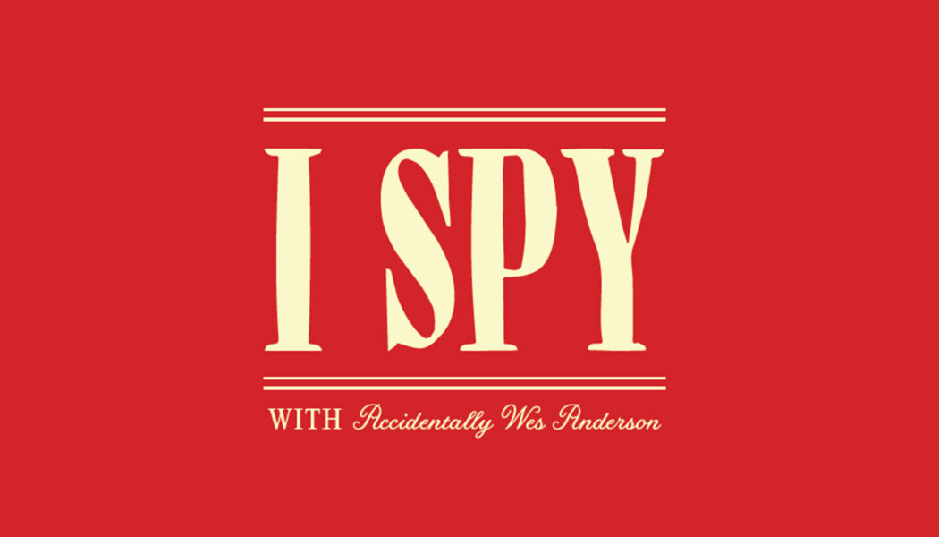 "I SPY with Accidentally Wes Anderson" typed in a cream color on a bright red background