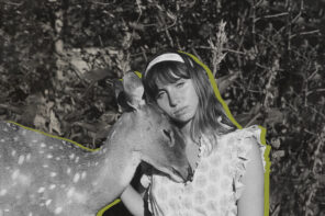 Black and white photo of a woman wearing a frilly dress and a mtaching colored headband. She is sitting on the ground outside while a deer stands next to her and is resting its head underneath the woman's head. The woman and the deer have a green-colored outline around the two of them.