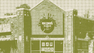 Store front of Wax Trax Records. The top of the building is a pointed triangle and then squares off on the sides as the building extends. There is an icon of a record above the door and has the word "Records" on it. The glass windows and doors have a Wax Trax sign, a neon open sign, and papers all plastered to the glass. The building is made of multicolored brick and the whole photo has a green halftone effect over it.