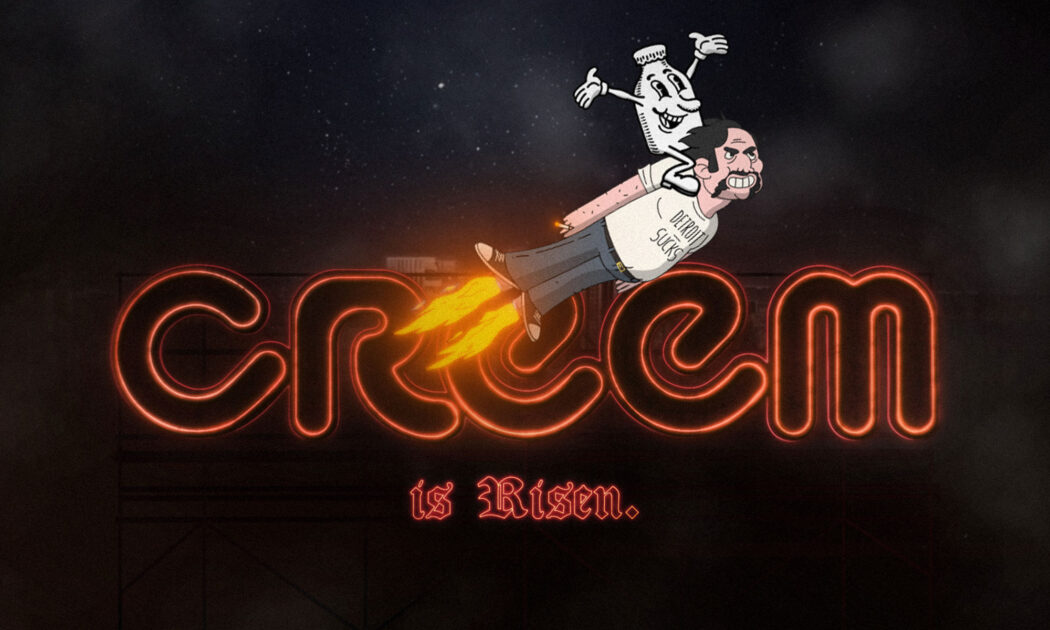 Photo of the CREEM magazine logo and the words "IS RISEN" below it in neon red lighting against a dark black background. A cartoon version of Lester Bangs with dark hair and a mustache is flying across the photo with flames coming from his feet and the CREEM mascot riding on his back. He is wearing his classic "DETROIT SUCKS" t-shirt.