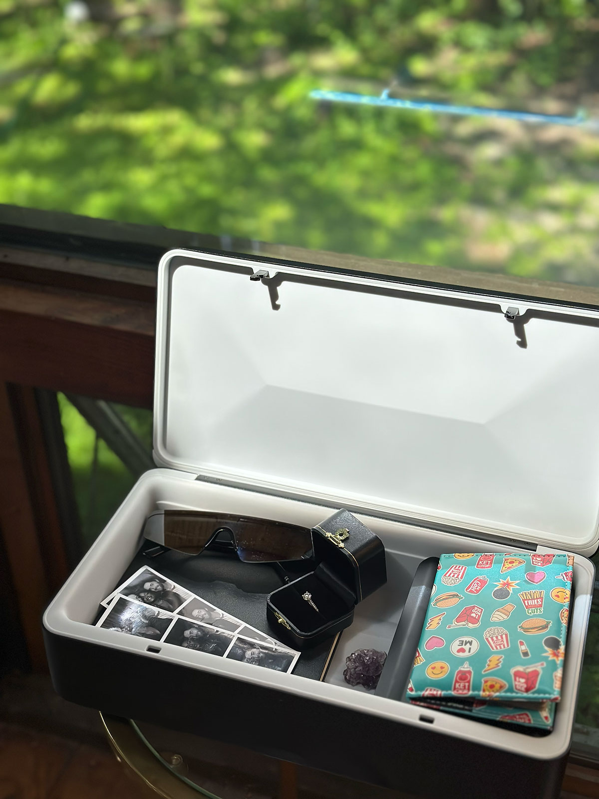 A TROVA safe with valuables and memorabilia inside