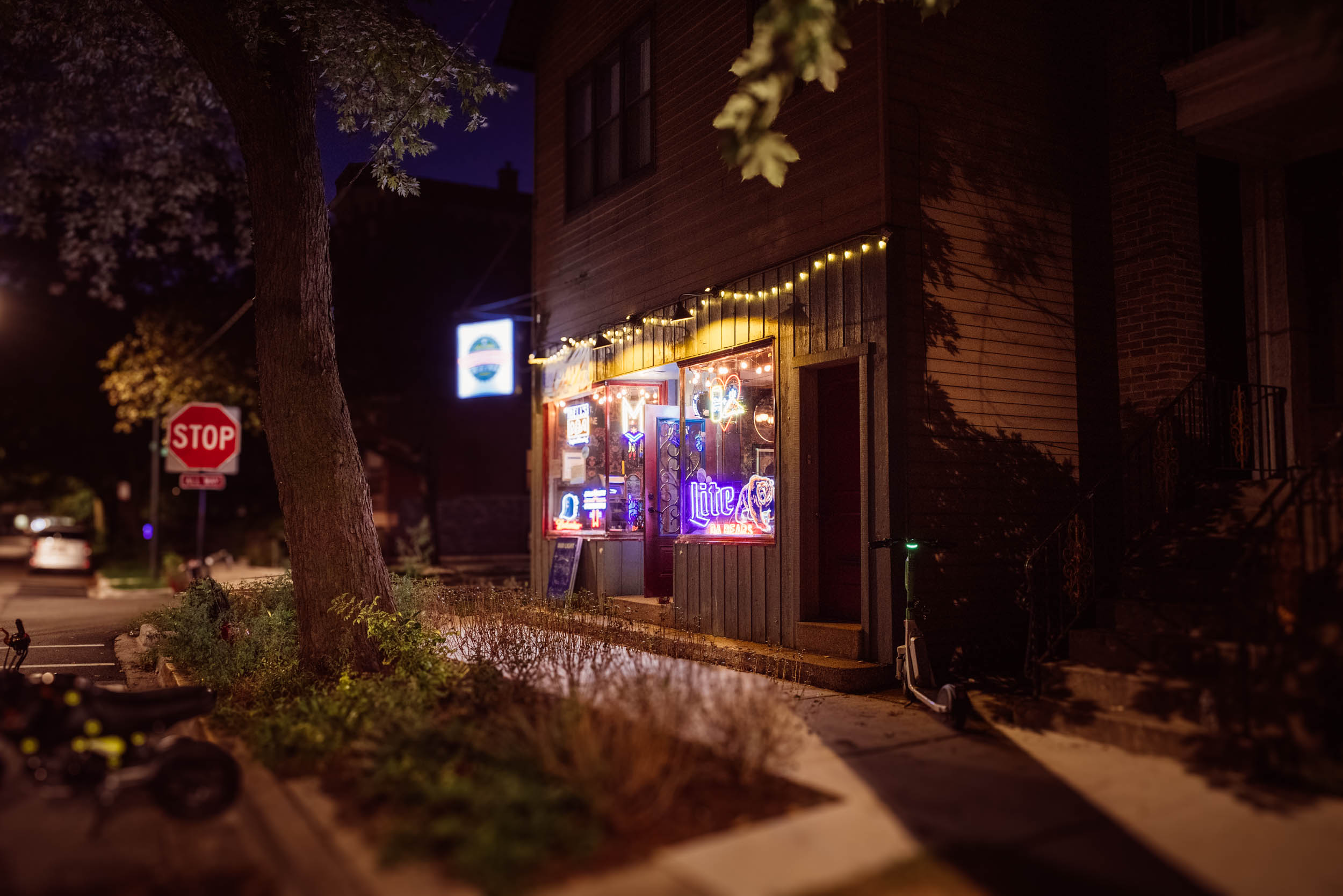 outside view of cozy lit pizza restaurant at night 