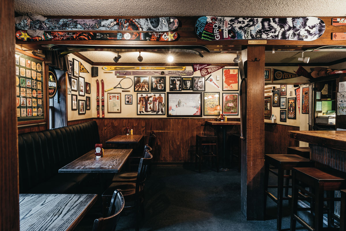 Interior of Cellar Pub with ski and snowboards hanging on the walls with other pictures and ski memorabilia. 
